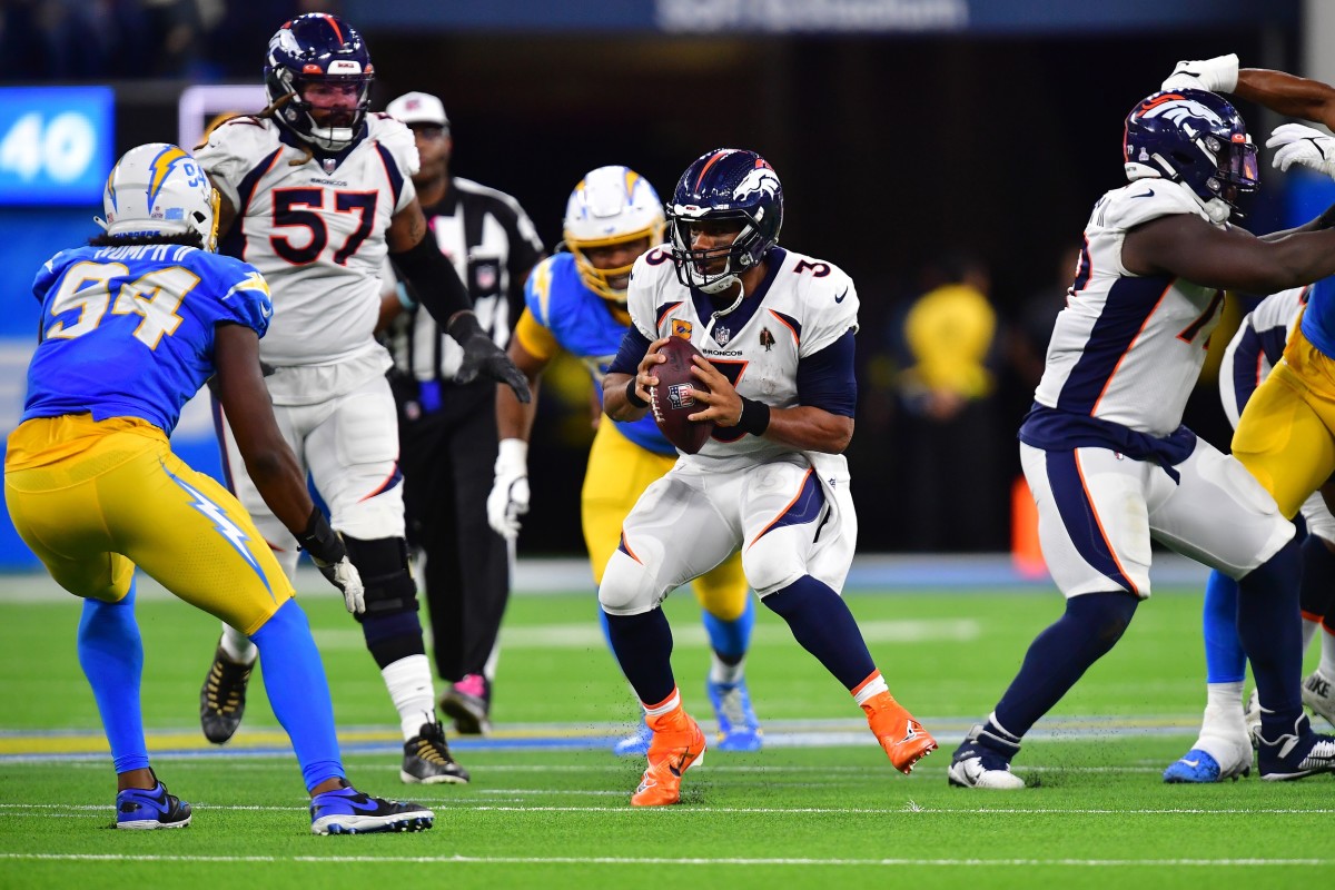 Denver Broncos quarterback Russell Wilson (3) runs the ball against the Los Angeles Chargers during the second half at SoFi Stadium.
