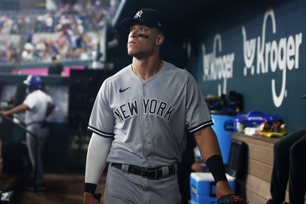 Yankees star Aaron Judge walks in the dugout. (2022)