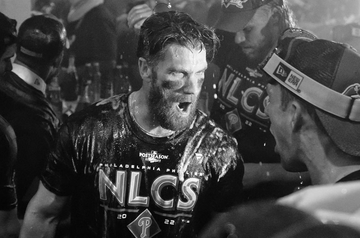 Bryce Harper celebrates with his teammates in the clubhouse after winning the NLDS.