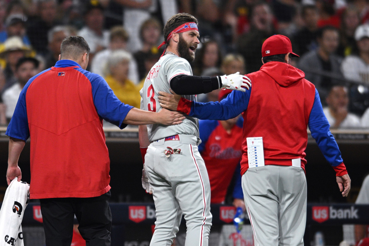 Bryce Harper exits after being struck on the thumb by a Blake Snell fastball.