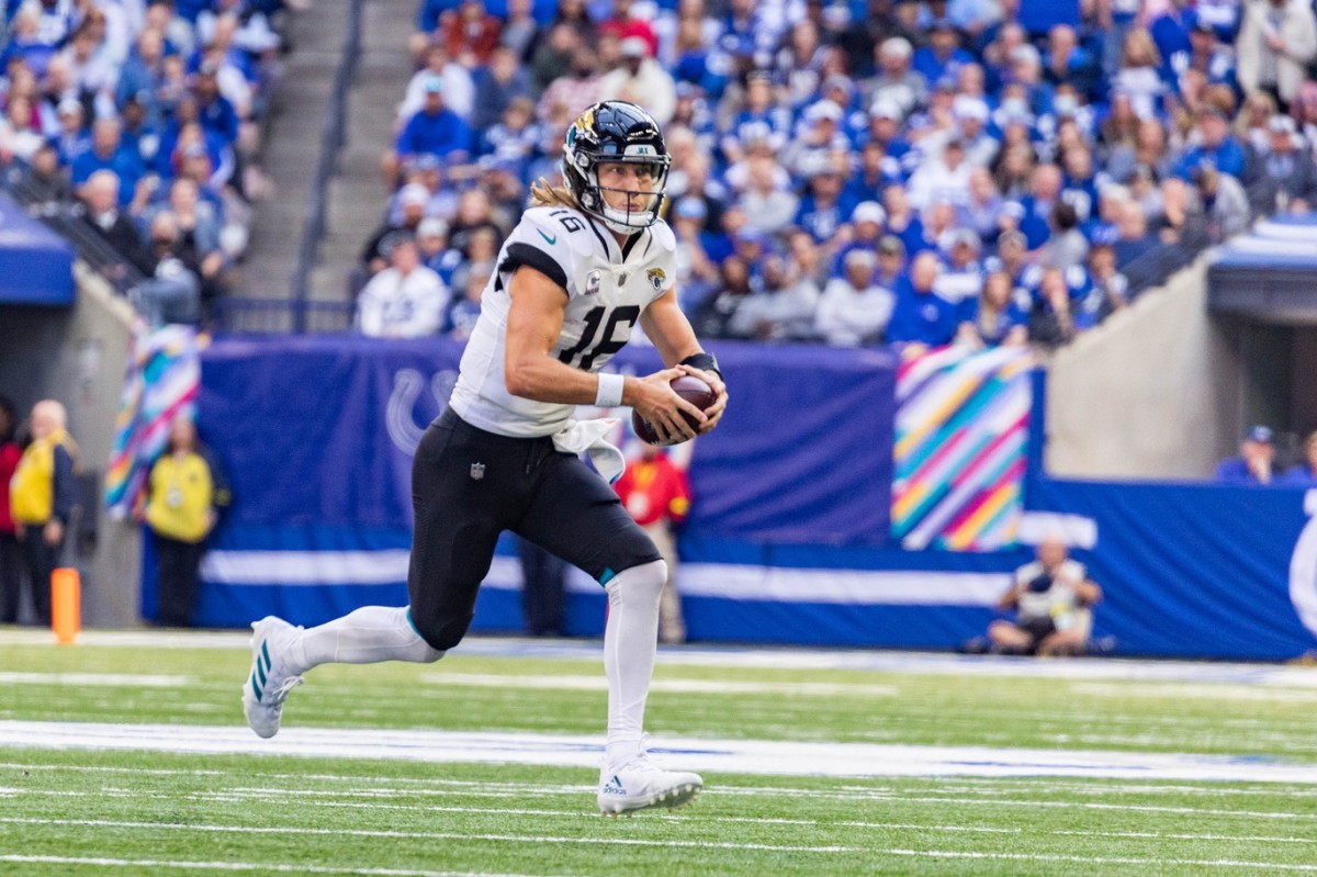 Oct 16, 2022; Indianapolis, Indiana, USA; Jacksonville Jaguars quarterback Trevor Lawrence (16) runs the ball in the second half against the Indianapolis Colts at Lucas Oil Stadium.