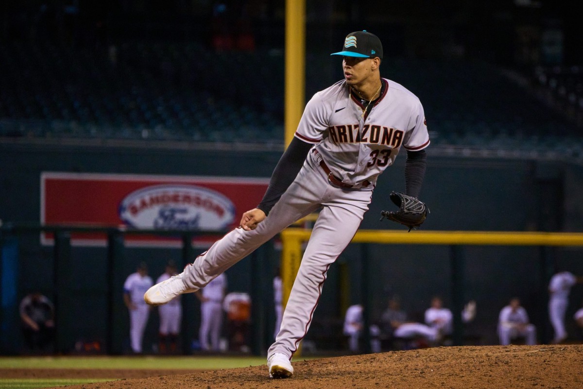 Oct 15, 2022; Phoenix, AZ, USA; Salt River Rafters pitcher Justin Martinez (33) pitches against the Surprise Saguaros at Chase Field. Mlb Dbacks Fall League Prospects