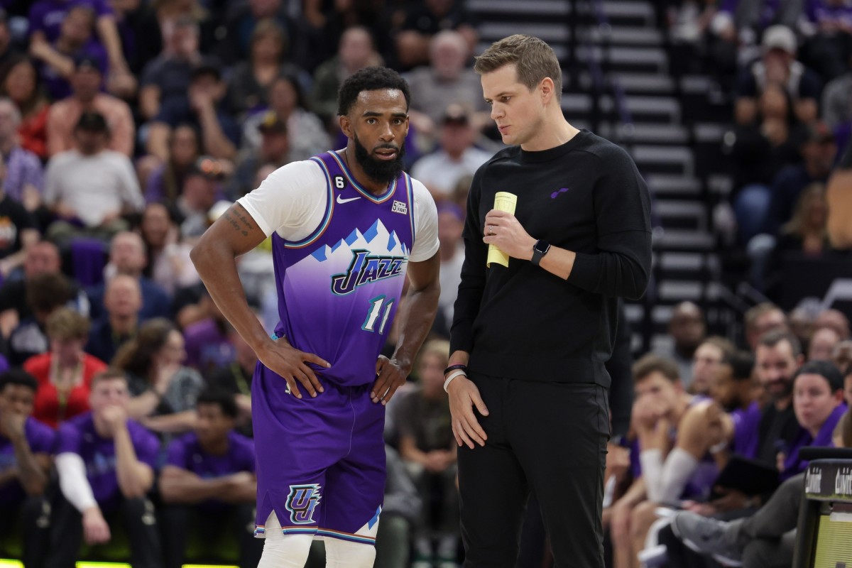 Utah Jazz guard Mike Conley (11) and Utah Jazz head coach Will Hardy talk during a stop in play during the second half against the Denver Nuggets at Vivint Arena.