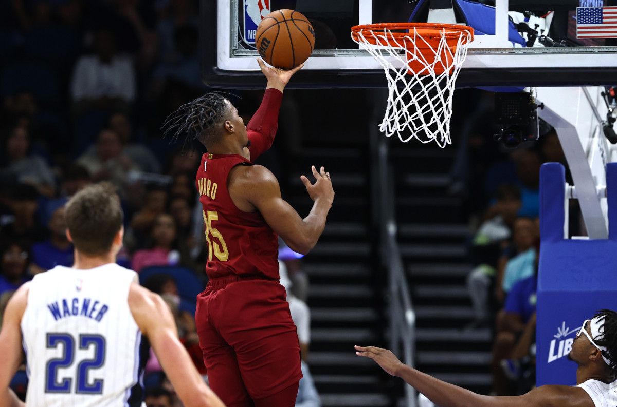 Oct 14, 2022; Orlando, Florida, USA; Cleveland Cavaliers forward Isaac Okoro (35) makes a layup against the Orlando Magic during the second half at Amway Center. Mandatory Credit: Kim Klement-USA TODAY Sports