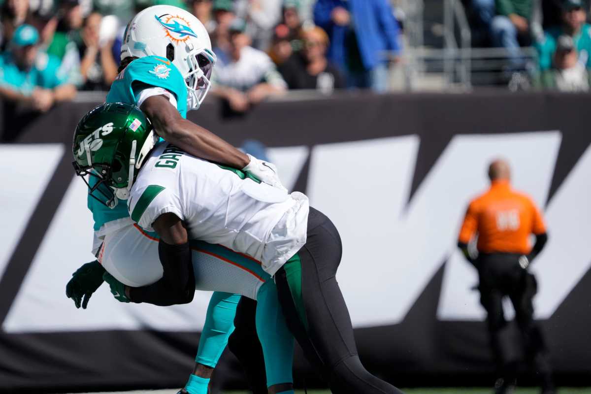 Jets cornerback Sauce Gardner takes down Dolphins quarterback Teddy Bridgewater in the end zone. Bridgewater left the field soon after the series. Syndication The Record