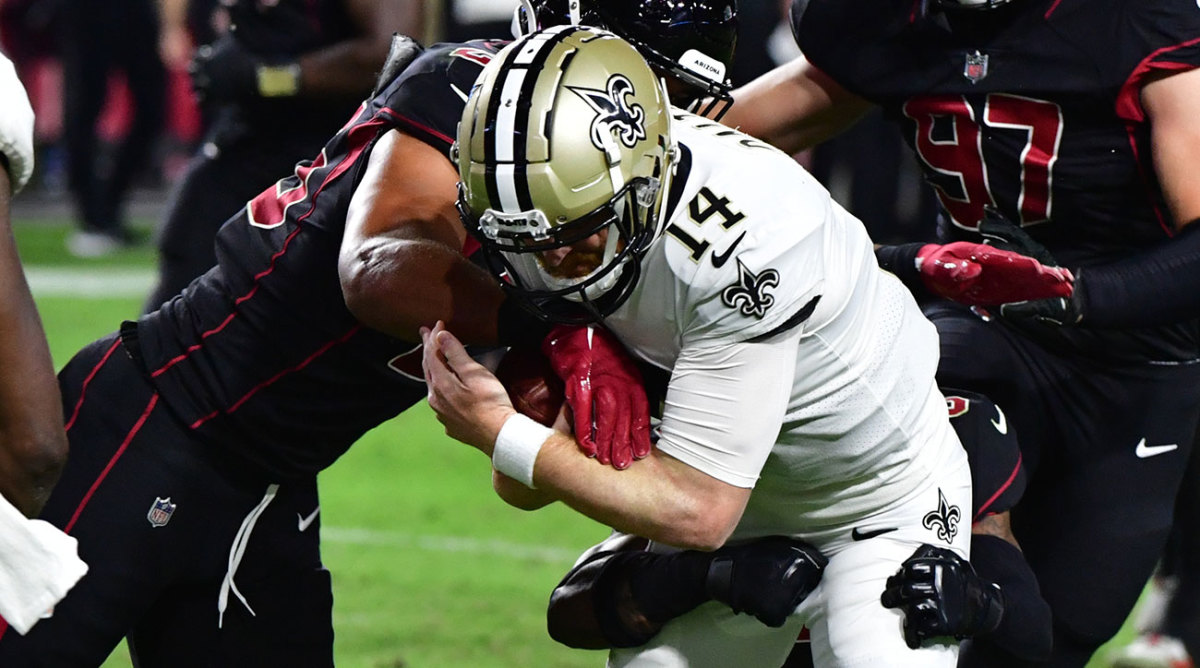 Andy Dalton gets wrapped up as the Saints lose to the Cardinals.