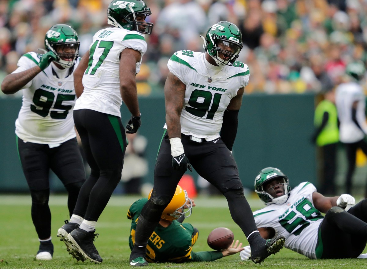 New York Jets defensive end John Franklin-Myers (91) celebrates sacking Green Bay Packers quarterback Aaron Rodgers (12) during their football game Sunday, October 16, at Lambeau Field in Green Bay, Wis. Dan Powers/USA TODAY NETWORK-Wisconsin Apc Packvsjets 1016221226djp