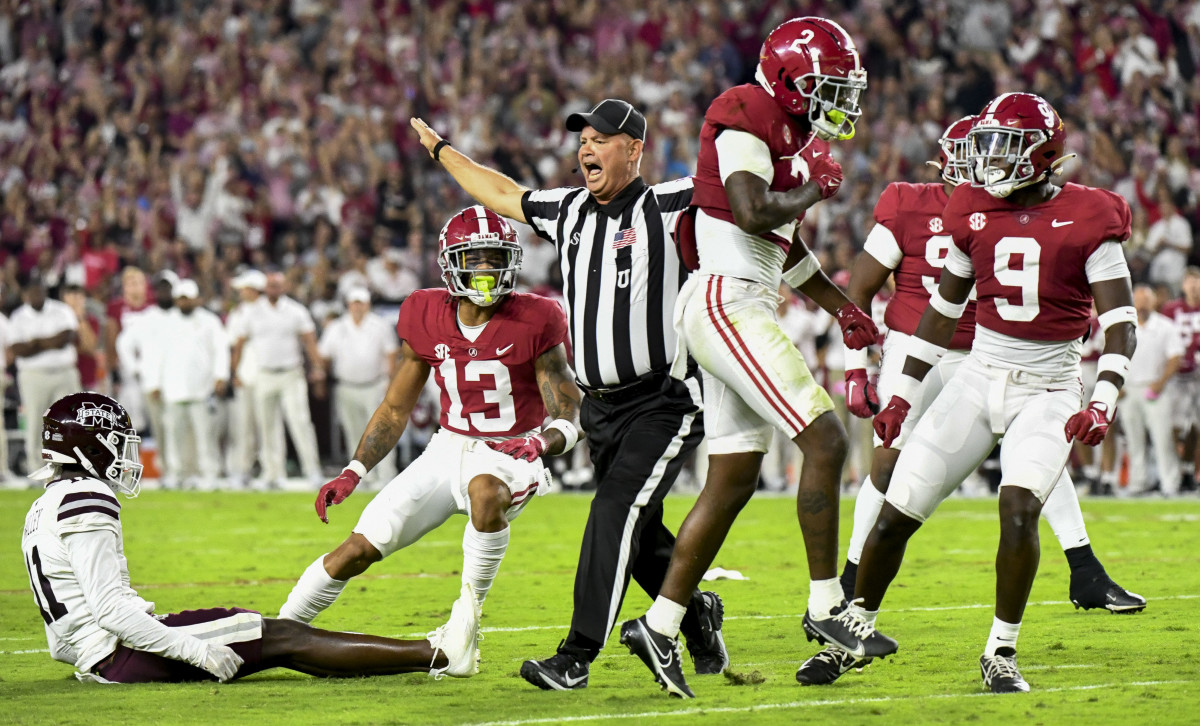 Alabama Crimson Tide defensive back DeMarcco Hellams (2) reacts after breaking up a fourth down pass attempt against Mississippi State Bulldogs wide receiver Jaden Walley (11) during the first half at Bryant-Denny Stadium.
