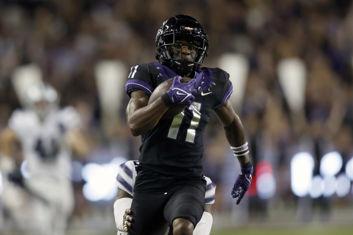 TCU Horned Frogs wide receiver Derius Davis (11) runs for a touchdown after catching a pass against the Kansas State Wildcats in the first quarter at Amon G. Carter Stadium.