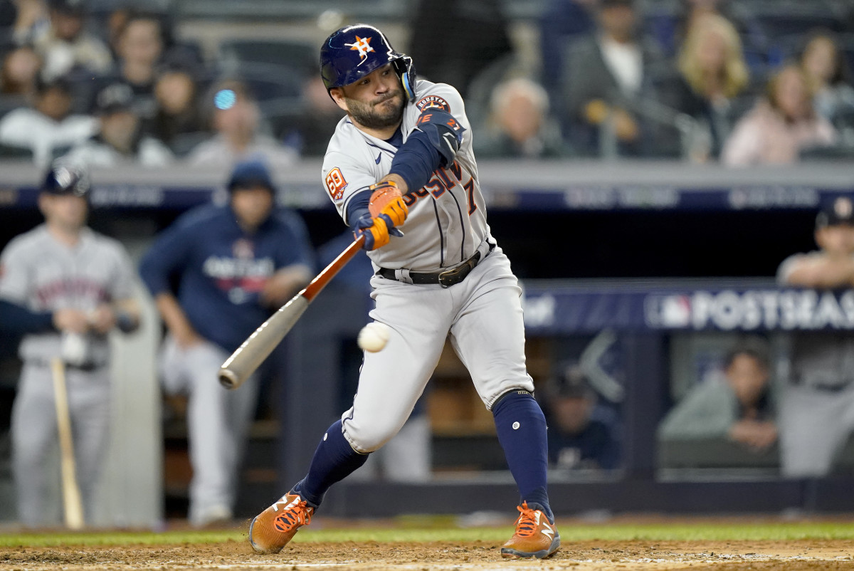 Astros second baseman Jose Altuve hits a double in Game 3 of the 2022 ALCS.