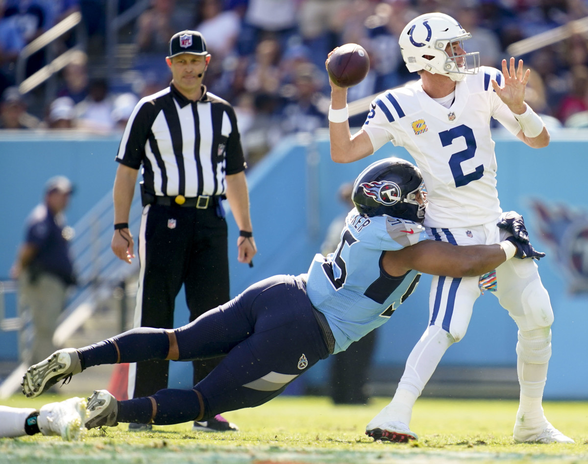 Oct 23, 2022; Nashville, Tennessee, USA; Indianapolis Colts quarterback Matt Ryan (2) gets hit by Tennessee Titans defensive end DeMarcus Walker (95) during the second quarter at Nissan Stadium Sunday, Oct. 23, 2022, in Nashville, Tenn.