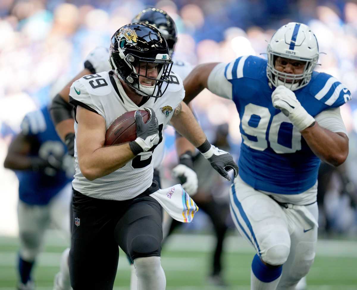 Indianapolis Colts defensive tackle Grover Stewart (90) chases after Jacksonville Jaguars tight end Luke Farrell (89) as he rushes the ball Sunday, Oct. 16, 2022, during a game against the Jacksonville Jaguars at Lucas Oil Stadium in Indianapolis.