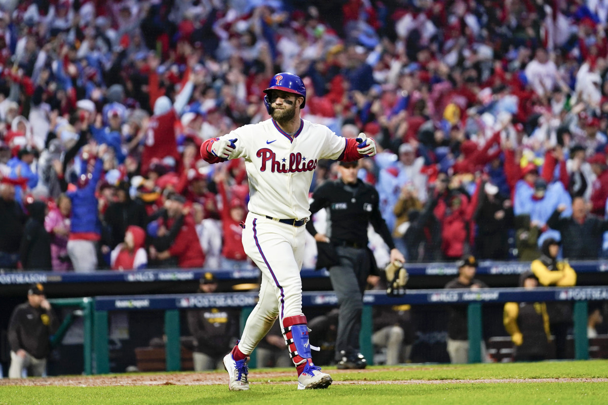 Phillies slugger Bryce Harper rounds the bases after hitting a pennant-winning two-run homer.