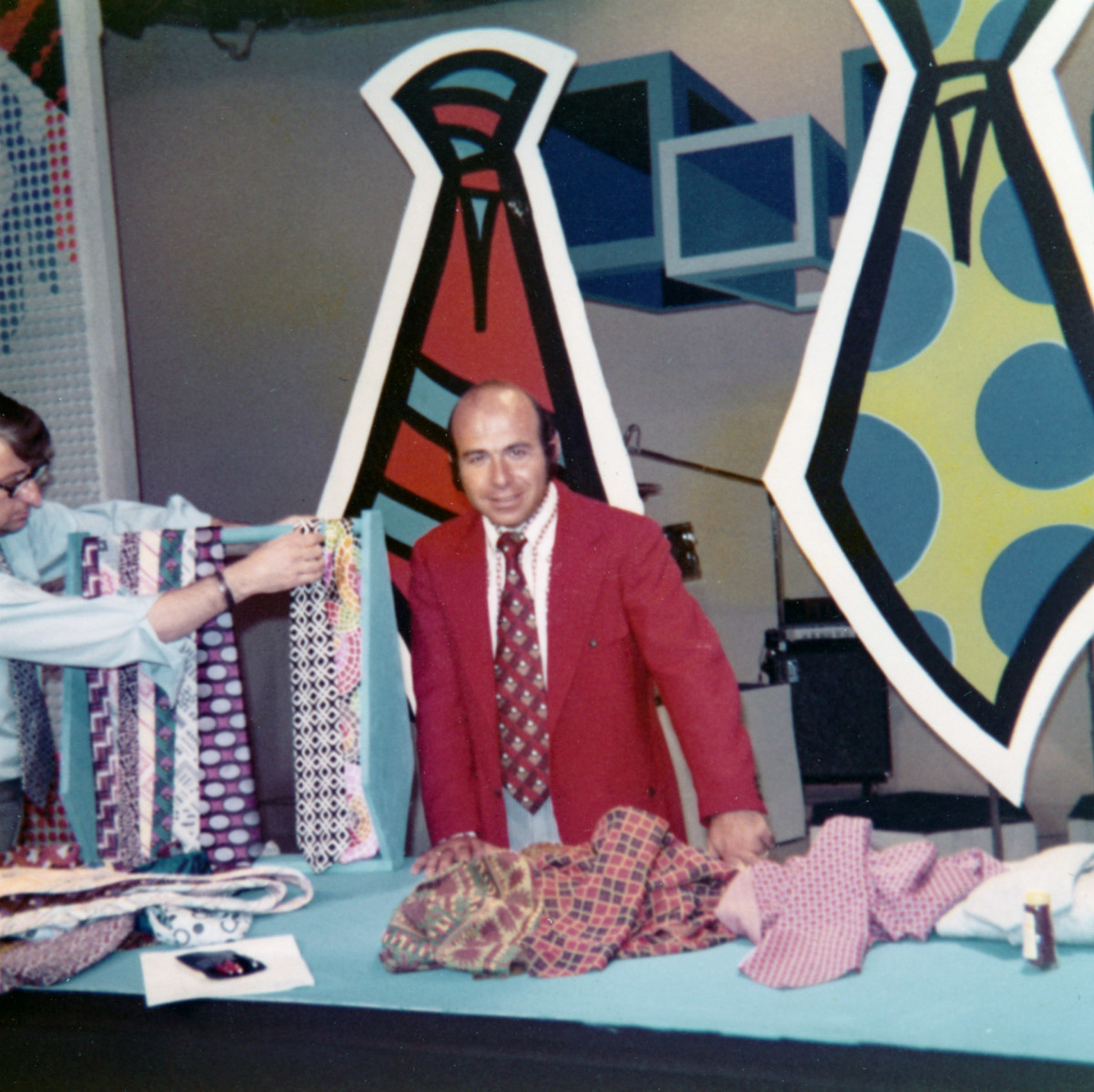 Garo Yepremian poses with his ties before a television appearance