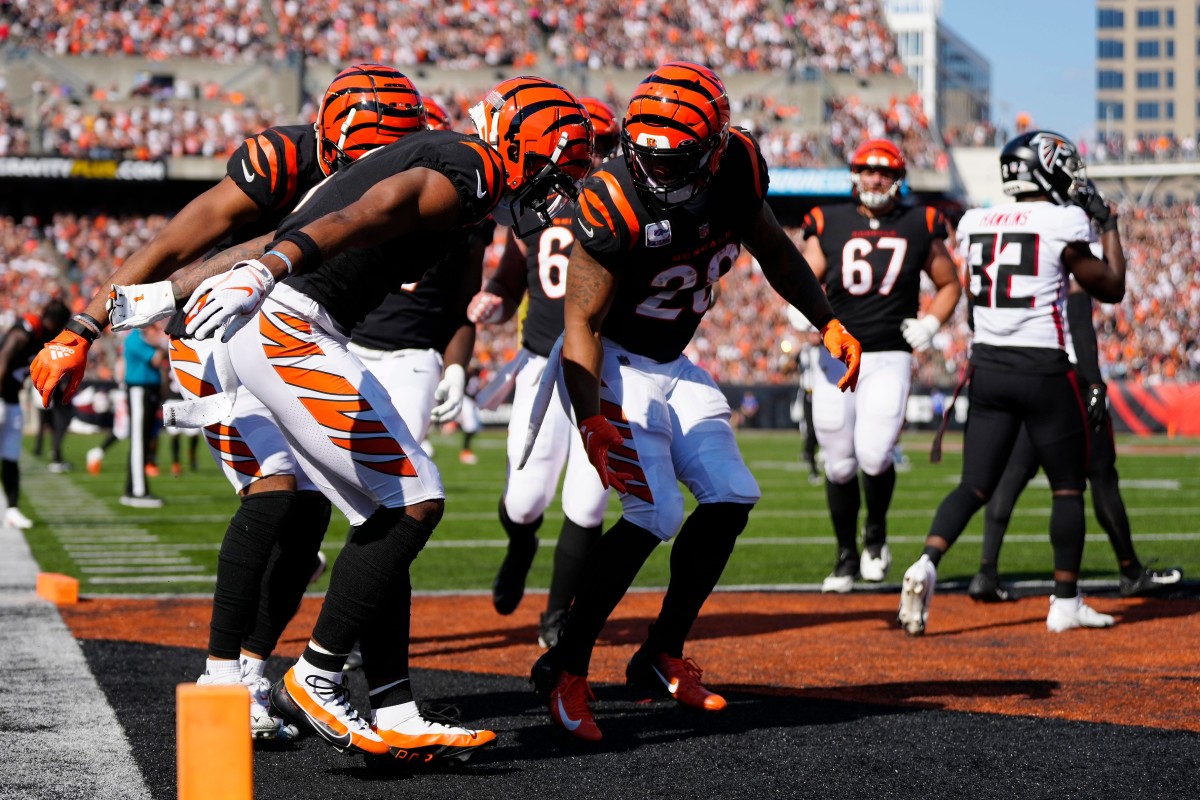 The Bengals offense celebrates a touchdown catch by wide receiver Ja'Marr Chase (1) in the second quarter of the NFL Week 7 game between the Cincinnati Bengals and the Atlanta Falcons at Paycor Stadium in downtown Cincinnati on Sunday, Oct. 23, 2022. The Bengals led 28-17 at halftime. Mandatory Credit: Sam Greene-The Enquirer Atlanta Falcons At Cincinnati Bengals Nfl Week 7