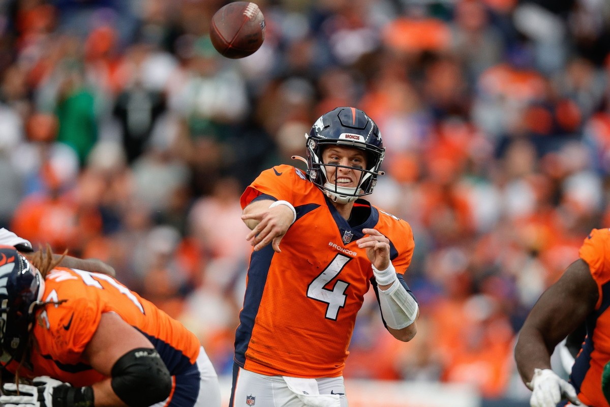 Denver Broncos quarterback Brett Rypien (4) attempts a pass in the fourth quarter against the New York Jets at Empower Field at Mile High.