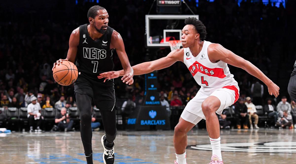 Oct 21, 2022; Brooklyn, New York, USA; Brooklyn Nets forward Kevin Durant (7) dribble with the ball defended by Toronto Raptors forward Scottie Barnes (4) during the third quarter at Barclays Center.