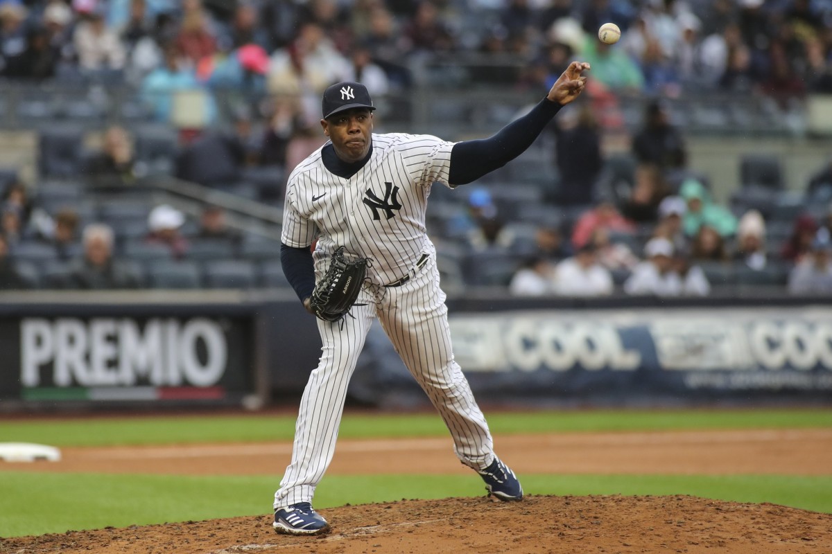 New York Yankees RP Aroldis Chapman throws pickoff to first base