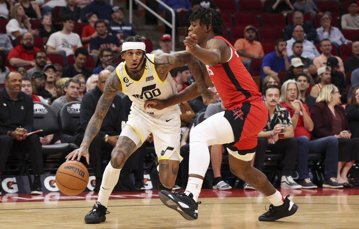 Utah Jazz guard Jordan Clarkson (00) dribbles against Houston Rockets guard Josh Christopher (9) in the second quarter at Toyota Center.