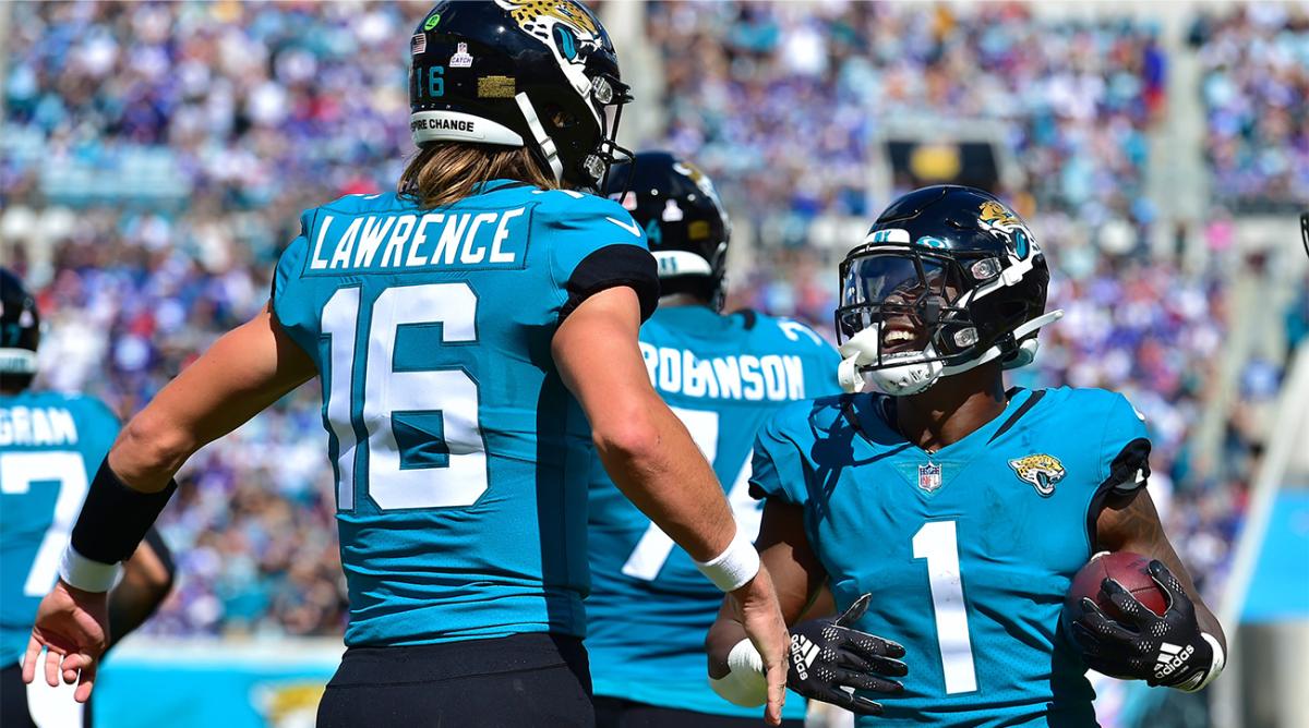 Jacksonville Jaguars running back Travis Etienne Jr. (1) celebrates his first quarter touchdown with quarterback Trevor Lawrence (16). The Jacksonville Jaguars hosted the New York Giants at TIAA Bank Field in Jacksonville, FL Sunday, October 23, 2022.