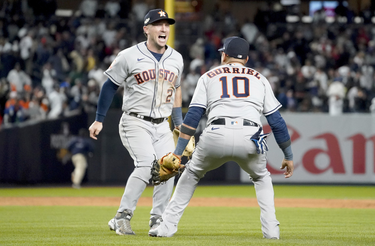 Astros third baseman Alex Bregman celebrates with first baseman Yuli Gurriel after beating the Yankees to clinch the AL pennant.