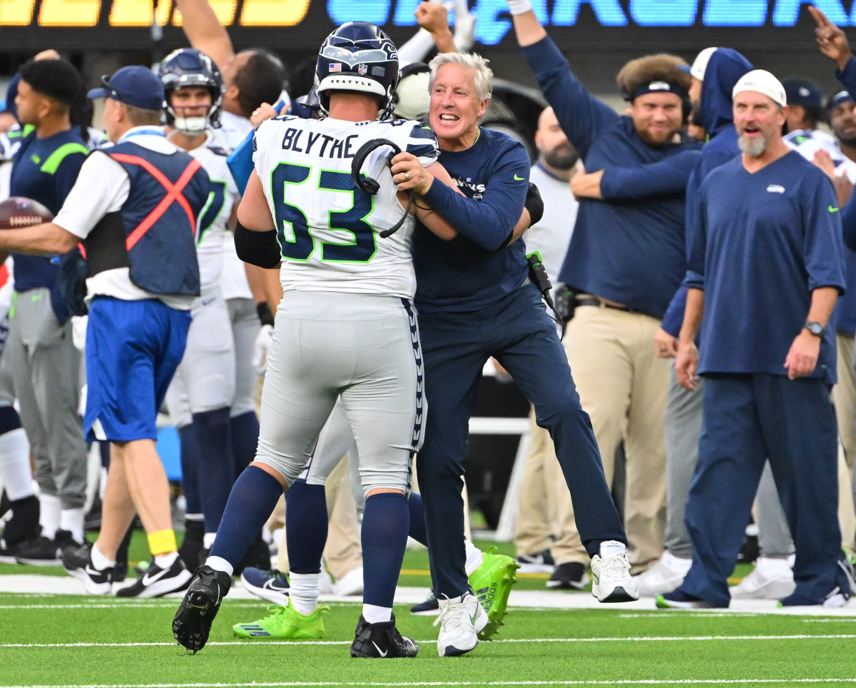 Seattle Seahawks head coach Pete Carroll celebrates with guard Austin Blythe (63) after a touchdown in the fourth quarter against the Los Angeles Chargers at SoFi Stadium.