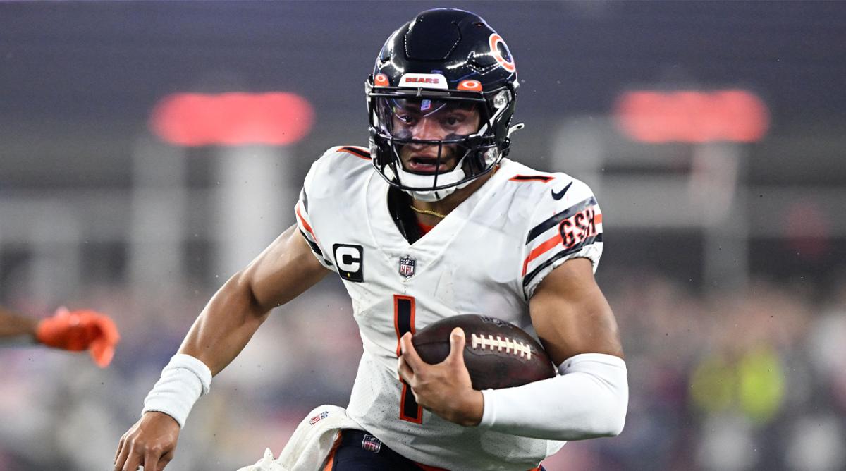 Oct 24, 2022; Foxborough, Massachusetts, USA; Chicago Bears quarterback Justin Fields (1) runs with the ball against the New England Patriots during the first half at Gillette Stadium.