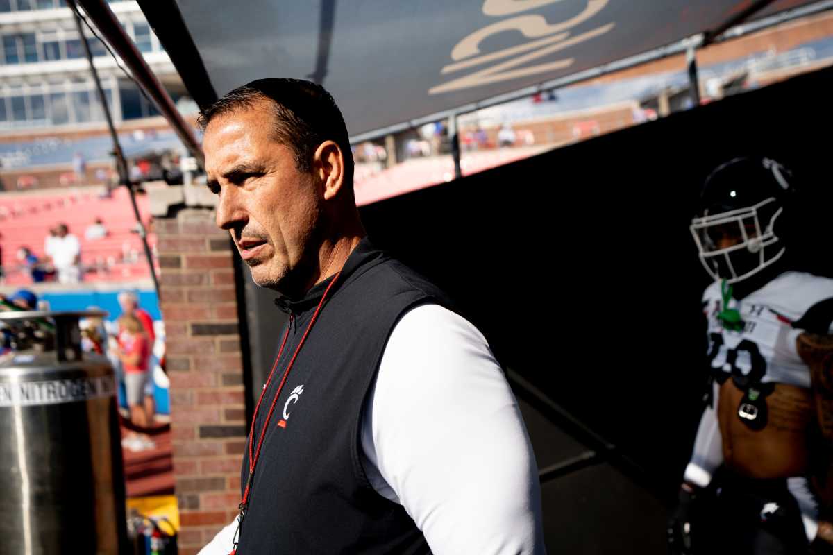 Cincinnati Bearcats head coach Luke Fickell walks onto the field before the American Athletic Conference game between the Cincinnati Bearcats and the Southern Methodist Mustangs at Gerald J. Ford Stadium in Dallas on Saturday, Oct. 22, 2022. Cincinnati Bearcats At Southern Methodist Mustangs 282