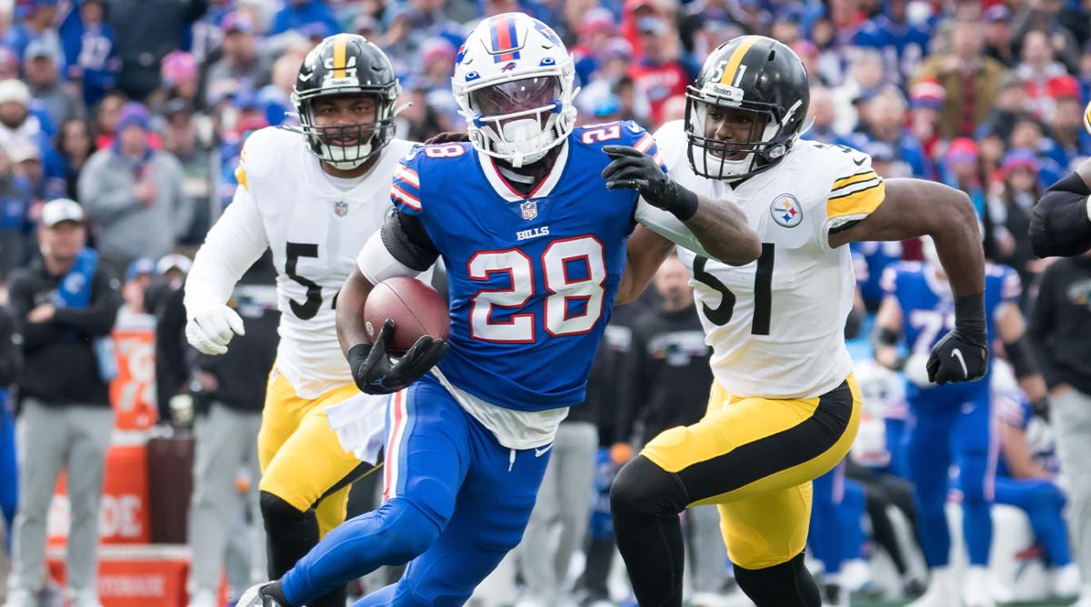Oct 9, 2022; Orchard Park, New York, USA; Buffalo Bills running back James Cook (28) and Pittsburgh Steelers linebacker Ryan Anderson (54) and linebacker Myles Jack (51) in the fourth quarter at Highmark Stadium.