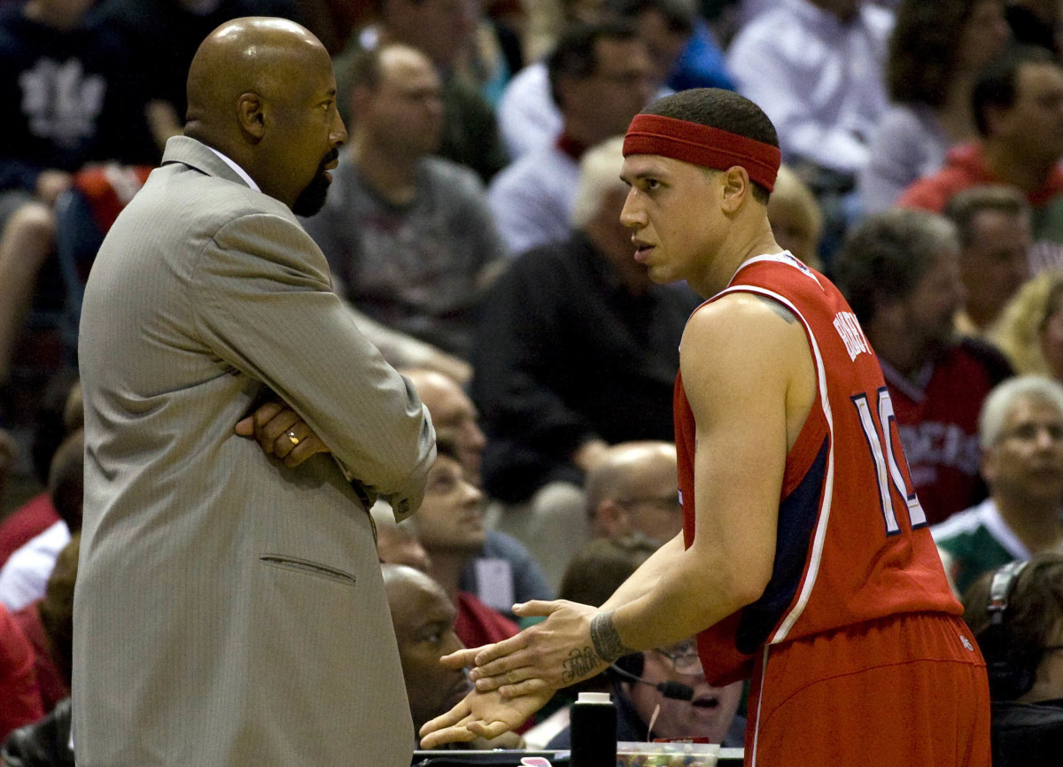 Apr 24, 2010; Milwaukee, WI, USA; Atlanta Hawks guard Mike Bibby (10) talks with head coach Mike Woodson during game three of the first round of the 2010 NBA playoffs against the Milwaukee Bucks at the Bradley Center. The Bucks defeated the Hawks 107-89.