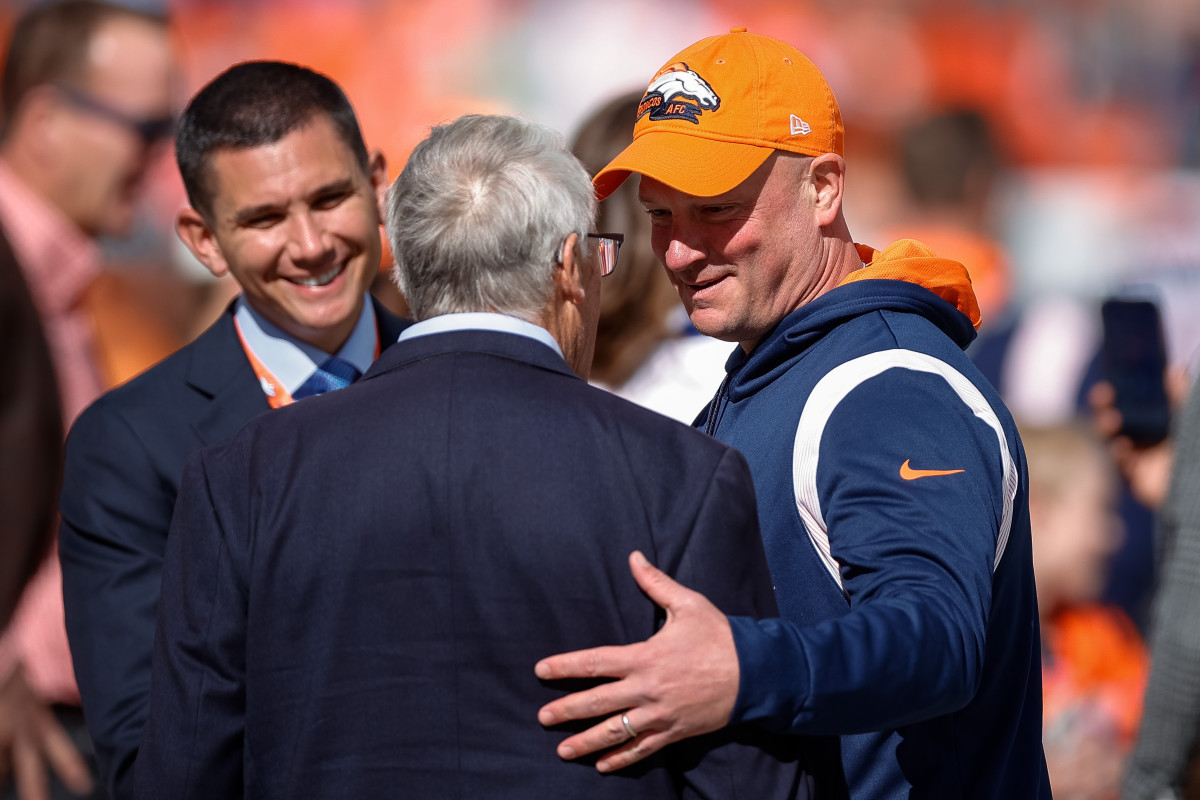Denver Broncos head coach Nathaniel Hackett greets owner Rob Walton before the game against the New York Jets at Empower Field at Mile High.