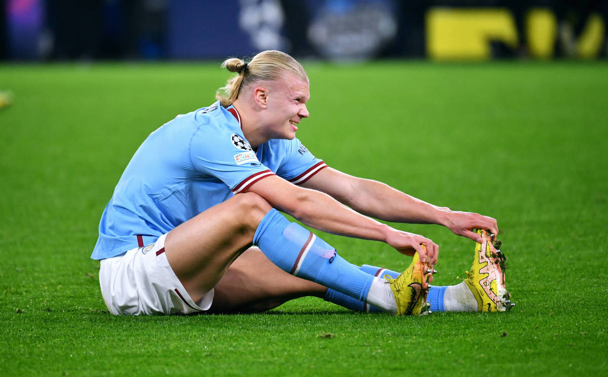 Erling Haaland pictured wincing in pain during Manchester City's 0-0 draw at Borussia Dortmund in October 2022