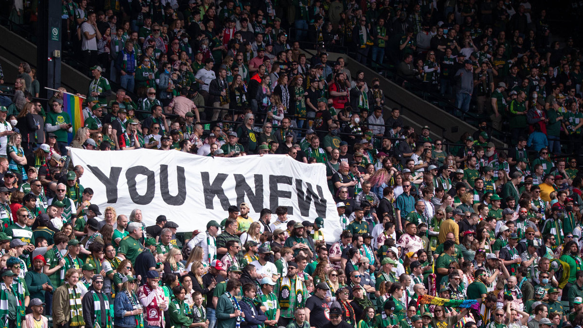 Portland fans hold up a “You Knew” sign during an MLS game.