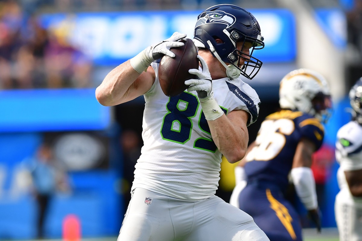 Oct 23, 2022; Inglewood, California, USA; Seattle Seahawks tight end Will Dissly (89) runs the ball after a catch against the Los Angeles Chargers during the first half at SoFi Stadium.