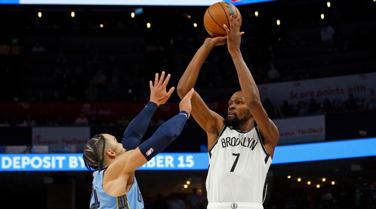 Oct 24, 2022; Memphis, Tennessee, USA; Brooklyn Nets forward Kevin Durant (7) shoots over Memphis Grizzlies forward Dillon Brooks (24) during the second half at FedExForum.