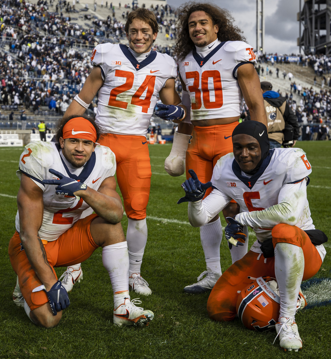 Chase (wearing No. 2) and Sydney (No. 30) with Illinois teammates.