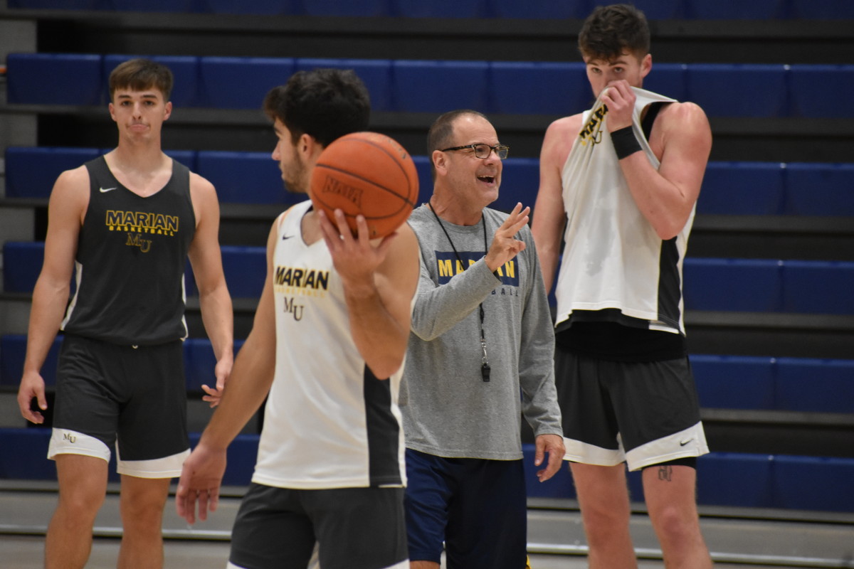 Marian coach Scott Heady and his son, Luke (middle), during practice this offseason.