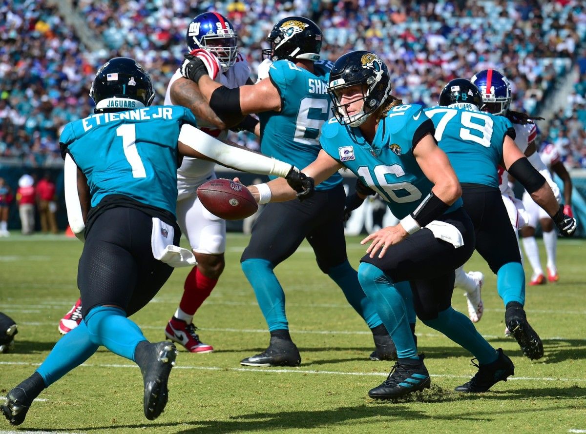 Jacksonville Jaguars quarterback Trevor Lawrence (16) hands off to running back Travis Etienne Jr. (1) during third quarter action. The Jacksonville Jaguars hosted the New York Giants at TIAA Bank Field in Jacksonville, FL Sunday, October 23, 2022. The Jaguars trailed at the half 11 to 13 and lost to the Giants with a final score of 17 to 23. [Bob Self/Florida Times-Union] Jki 102322 Hsfb Bs Jaguars Vs Giants 58