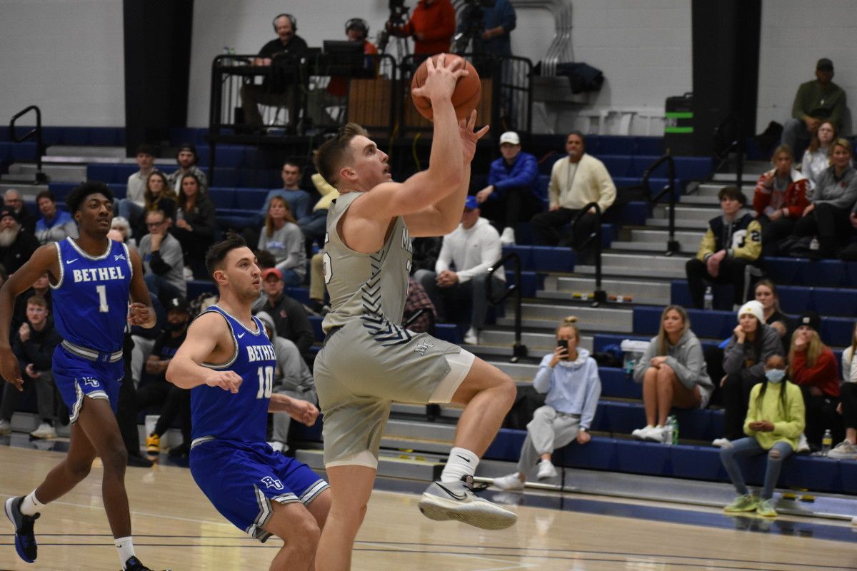 Marian's Hayden Langkabel drives for a layup against Bethel University.