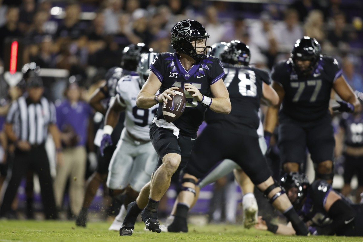 TCU Horned Frogs quarterback Max Duggan (15) rolls out to pass against the Kansas State Wildcats in the first quarter at Amon G. Carter Stadium.