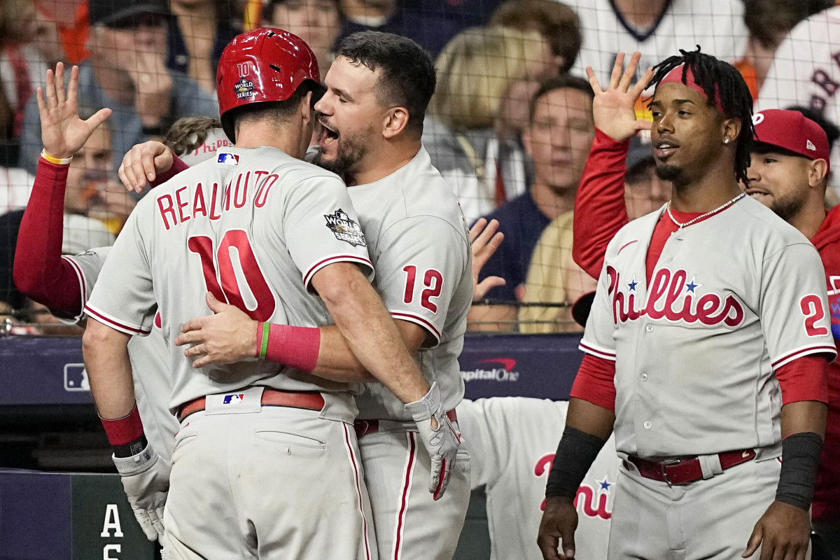 J.T. Realmuto and Kyle Schwarber celebrate Realmuto’s go-ahead home run in Game 1 of the World Series.