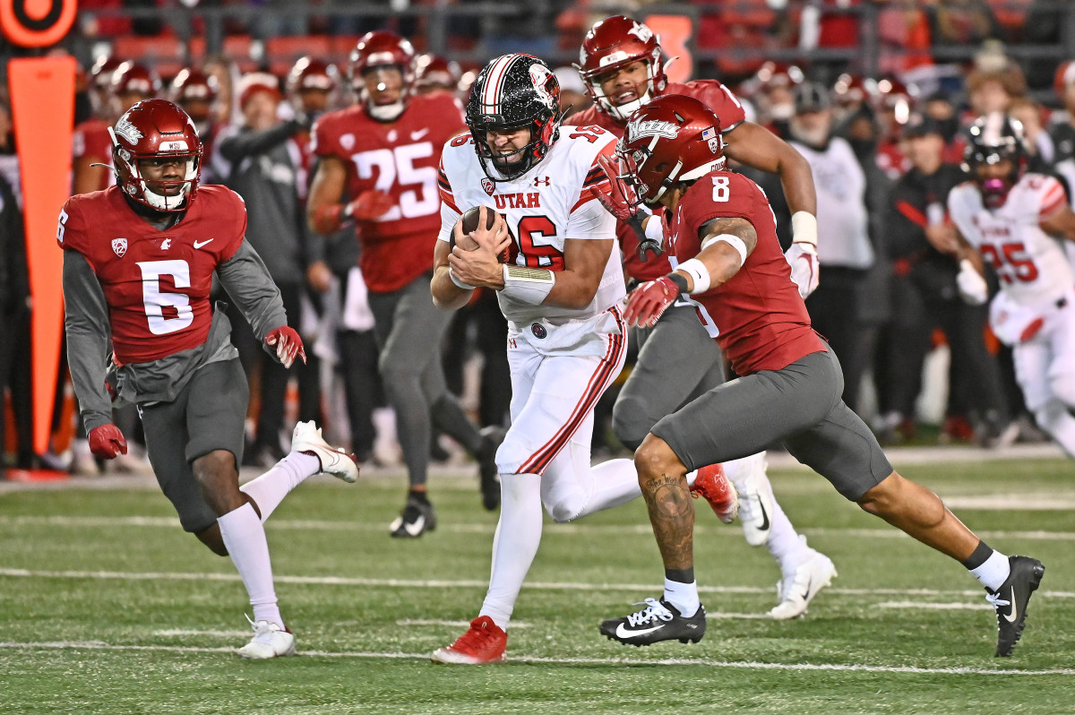 Utah Utes quarterback Bryson Barnes (16) moves the ball against Washington State Cougars defensive back Chau Smith-Wade (6) and defensive back Armani Marsh (8) in the second half at Gesa Field at Mart.