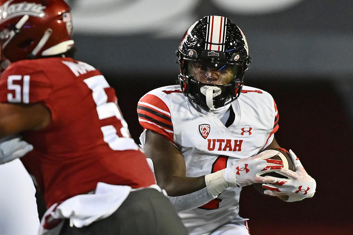 Utah Utes running back Jaylon Glover (1) carries the ball against the Washington State Cougars in the first half at Gesa Field at Martin Stadium.