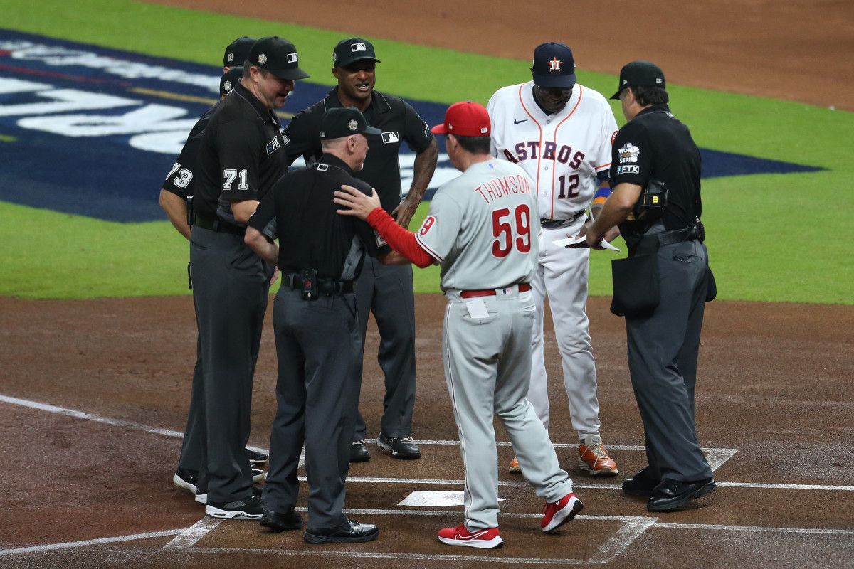 Houston Astros manager Dusty Baker (12) and Philadelphia Phillies manager Rob Thomson (59) exchange lineup cards before game one of the 2022 World Series