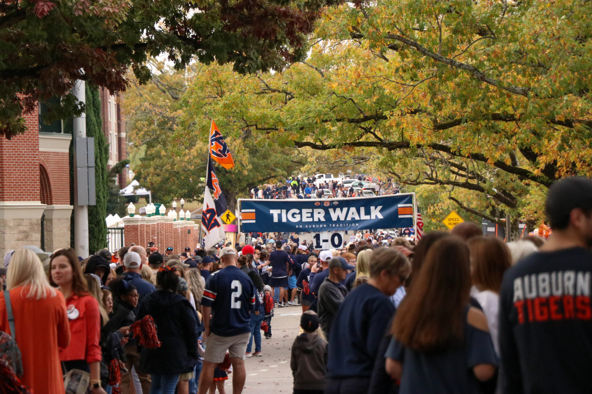 The Auburn fans gather for Tiger Walk before the Tigers and the Razorbacks clash.