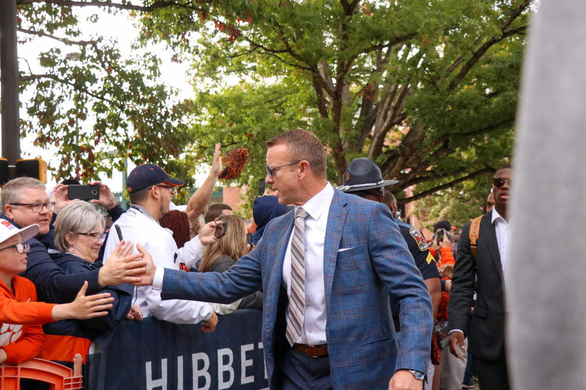 Bryan Harsin welcomes the early Tiger Walk crowd before the Tigers and the Razorbacks kick off.