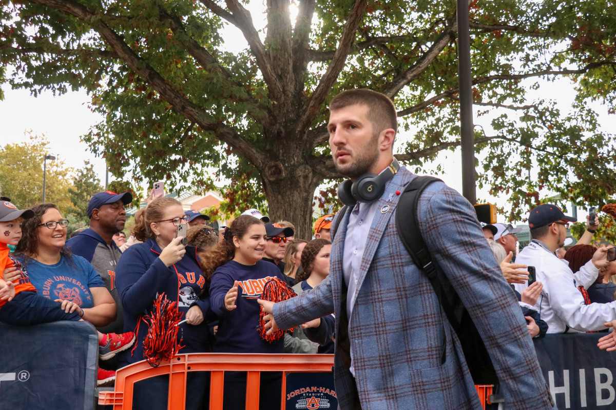 John Samuel Shenker greets the early Auburn fans at Tiger Walk.