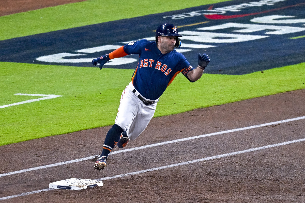 Jose Altuve rounds first base and heads for second for a leadoff double in Game 2 of the World Series.
