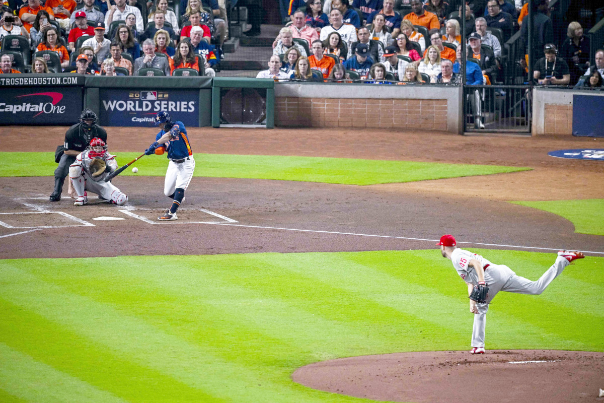 Jose Altuve hits a leadoff double in Game 2 of the World Series.