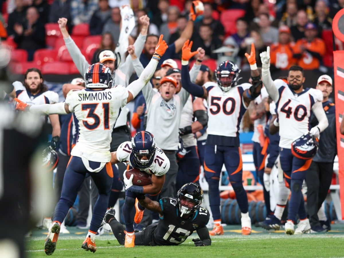 Denver Broncos cornerback KWaun Williams (21) intercepted the ball from Jacksonville Jaguars quarterback Trevor Lawrence (16) (not pictured) in the fourth quarter during an NFL International Series game at Wembley Stadium.